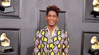 Jon Batiste, wearing a sequinned suit. AFP