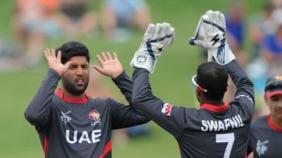 UAE bowler Mohammed Naveed, left, celebrates taking a wicket at last month's 2015 Cricket World Cup in New Zealand with wicketkeeper Swapnil Patil. Ross Setford / AP / March 4, 2015