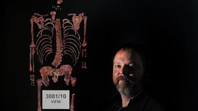 Leigh Olver, Ned Kelly's great grand-nephew poses for a photo in front of the recently discovered remains - minus skull - of Ned Kelly at the Victorian Institute of Forensic Medicine in Melbourne, Australia. Julian Smith / EPA