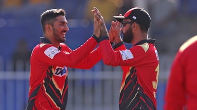Khuzaima Tanveer, left, of Desert Vipers celebrates after taking the wicket of Tim Seifert of Sharjah Warriorz in their DP World International League T20 eight-wicket victory at the Sharjah Cricket Stadium on January 25, 2025. ILT20