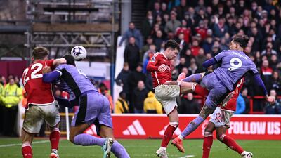 Liverpool's Darwin Nunez heads the winner. AFP