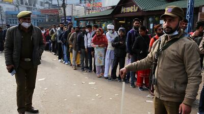 Devotees line up for registration to visit the shrine after the stampede. AP Photo