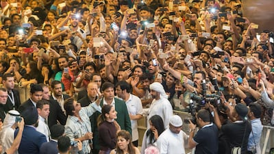 The Bollywood stars wave to the crowd at Dalma Mall. Antonie Robertson / The National