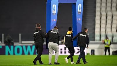 The Serie A arch is carried away by stewards after Napoli's no show. Getty Images