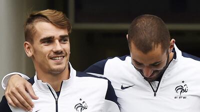 Frenchman Antoine Griezmann, left, is starting to find his role in his first season with Atletico Madrid. John MacGougall / AFP