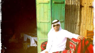 Day trip with friends to the Western Region and the Mazayin Dhafra Camel Festival, 220 kms west of Abu Dhabi on December 20, 2013. A merchant poses outside his shop at the traditional souk. Picture taken with the Hipstamatic app for the iPhone. Liz Claus / The National