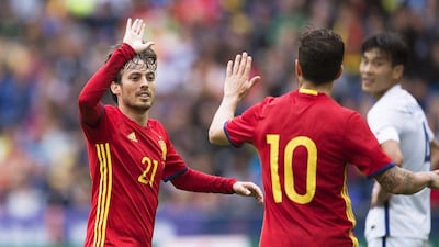 Spain’s David Silva (L) celebrates with his teammate Cesc Fabregas (R) after scoring the 1-0 lead during the international friendly match between Spain and South Korea in Salzburg, Austria, 01 June 2016. The Spanish national team prepare for the upcoming Uefa Euro 2016 championship in France. Andreas Schaad / EPA