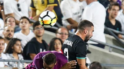 Manchester City defender John Stones, left, and Real Madrid defender Daniel Carvajal battle for the ball during their International Champions Cup (ICC) football match on July 26, 2017 at the Los Angeles Memorial Coliseum in Los Angeles, California. City won the match 4-1. Ringo Chiu / AFP