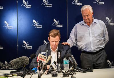 Former Australian captain Steve Smith, left, with his father Peter Smith, apologised at a news conference for the ball-tampering row that had led to him being banned by Cricket Australia for 12 months. Brendan Esposito / AAP Image via AP