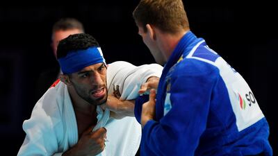 Iran's Saeid Mollaei, left, fights Belgium's Matthias Casse during the semi-final of the men's under 81kg category during the 2019 Judo World Championships at the Nippon Budokan, Tokyo, Japan. AFP