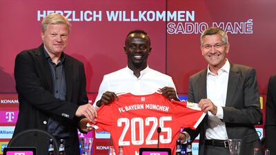 Left to right: Oliver Kahn, Sadio Mane and Herbert Hainer. Reuters