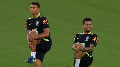 Brazil players Thiago Silva, left, and Dani Alves take part in a training session. Vanderlei Almeida / AFP