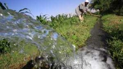A Sudanese farmer prepares his land for irrigation on the banks of the river Nile in Khartoum.
