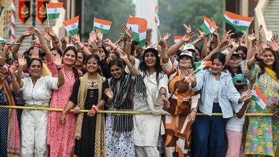 Indians gather to watch the beating retreat ceremony at the Attari-Wagah border between Pakistan and India, on the eve of Independence Day. AFP