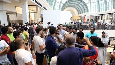 A crowd waits outside the Apple store before the launch of iPhone 7 at the Mall of the Emirates. Pawan Singh / The National