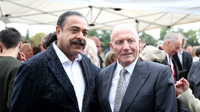 Shahid Khan with former Fulham star George Cohen. PA