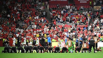 Egypt players celebrate with a prayer after the match. Reuters