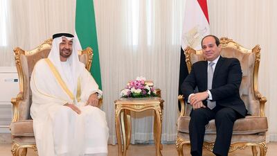 Sheikh Mohamed sits with President Sisi. EPA