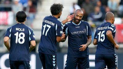 Pierre van Hooijdonk of Laureus All-Stars and Thierry Henry celebrate the fourth goal. Christof Koepsel / Getty Images