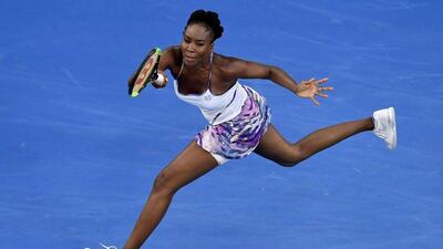 Venus Williams makes a forehand return to her sister Serena during the women's singles final at the Australian Open. Andy Brownbill / AP