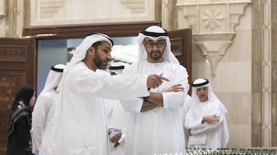 Sheikh Mohammed bin Zayed and Musabah Al Marar, general manager of Abu Dhabi Municipality, admire the architecture model of Al Maqta The Canal Walk on their way to the Executive Council meeting at the Abu Dhabi Crown Prince Court on Thursday, where the Crown Prince of Abu Dhabi and Deputy Supreme Commander of the Armed Forces announced an anti-corruption taskforce. Ryan Carter / Crown Prince Court