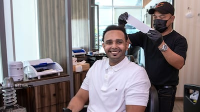 Mr Al Mubarak, 34, at Urban Cuts Barbershop in Abu Dhabi.
