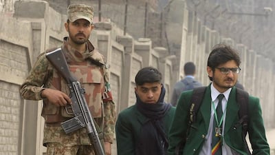 A soldier stands guards outside the Army Public School, in Peshawar, which was targeted by Taliban militants in December. Mohammad Sajjad / AP Photo