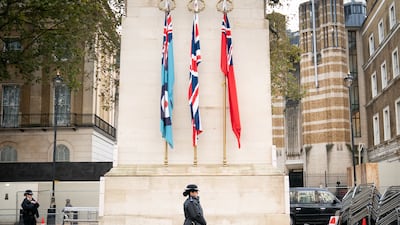A Metropolitan Police officer on duty beside the Cenotaph in Whitehall, central London. PA