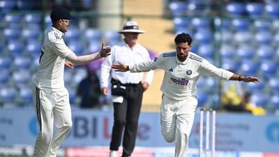 India spinner Kuldeep Yadav celebrates after taking the wicket of West Indies' Shai Hope for 36. AFP