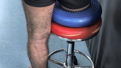 Seif Salman has been receiving physio to strengthen his thighs since having his right leg below the knee amputated. Ameer Hazim for The National