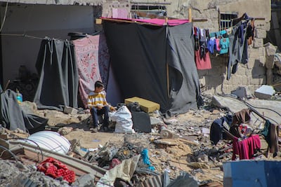 Displaced Palestinians construct makeshift shelters amid the rubble of destroyed homes in Khan Younis after fleeing from Rafah in the southern Gaza Strip. Bloomberg.