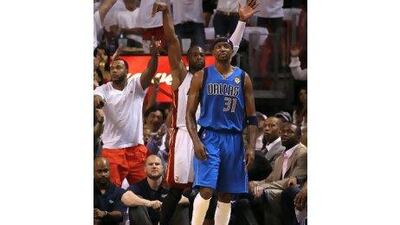 Dwyane Wade, behind, and his showboating was not unnoticed by Dallas's Jason Terry. Mike Ehrmann / Getty Images