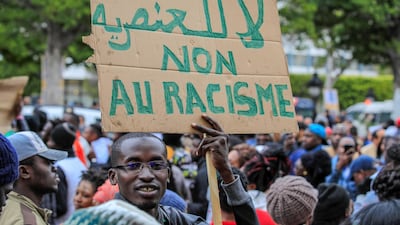 A protest over the killing of Falikou Coulibaly held in front of the Municipal Theatre building in Tunis on December 25, 2018. Anadolu Agency / Getty Images