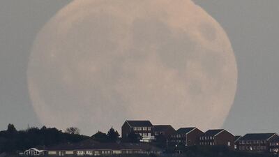 A “supermoon’’ rises above Brighton in southern England. TToby Melville / Reuters