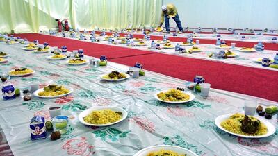 Day 15 — ‘Ramadan is the month of giving. Lots of mosques set up a tent outside to give free food to workers, who come from around the area to break their fast with rice and Laban.’ Ammar Al Attar for The National