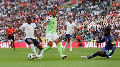 England's Raheem Sterling, left, was criticised for diving to try and win a penalty against Nigeria at Wembley. Carl Recine / Reuters