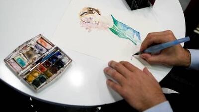 ABU DHABI, UNITED ARAB EMIRATES ??? March 15, 2011: Omar Jaramillo Traverso illustrates a picture of Kate Forrester at Illustrators' Corner during the opening day of the Abu Dhabi International Book Fair at ADNEC. ( Andrew Henderson / The National )The illustrator Omar Jaramillo Traverso sketches a portrait of the book cover artist Kate Forrester at the Illustrators’ Corner yesterday at Adnec.