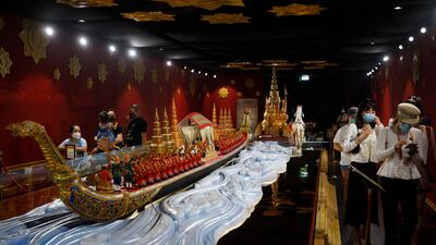 Models of gold and red dragon boats greet visitors, after which short films showcase trade and technology in Thailand. Photo: Expo 2020