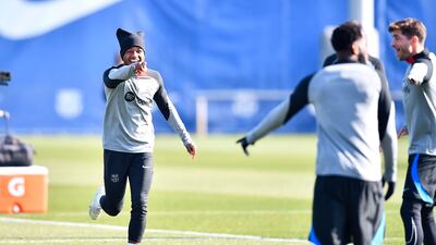 Barcelona forward Ansu Fati shares a joke at training. AFP