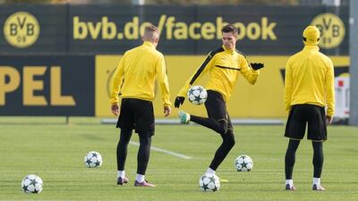 Borussia Dortmund’s Julian Weigl, centre, attends training. Guido Kirchner / DPA / AFP