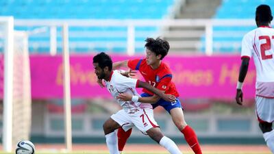 Sultan Bargash, left, of the UAE in action against South Korea during a warm-up match for the Asian Games. Courtesy UAE FA