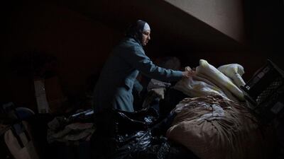 Masjid Al-Islam member Naima (née Nancy) Carr, 29, sorts through clothing, blankets and non-perishable items to be donated to the poor in a storage room of her home in the Las Playas neighborhood of Tijuana. Carr and other congregants of the mosque run a 'Food Drop' in which they try to help deportees and other impoverished individuals living along the border between U.S. and Mexico.