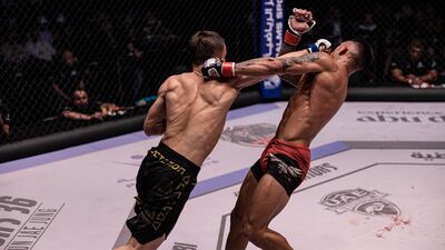 Bekzat Almakhan lands a powerful right on Mauro Mastromarini.