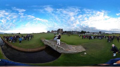 Tyrrell Hatton of England celebrates with trophy on Silken Bridge on the 18th green after winning the Alfred Dunhill Links Championship at The Old Course in St Andrews, Scotland. Richard Heathcote / Getty Images