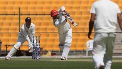 Afghanistan's Mohammad Nabi, centre, bats during an Intercontinental Cup match against Scotland on Wednesday at the Zayed Cricket Stadium in Abu Dhabi. Ravindranath K / The National