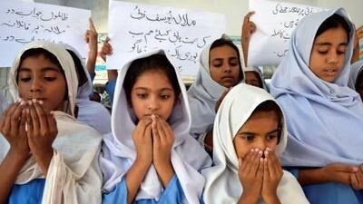 Pakistani school girls praying for the recovery of 14-year-old child activist, Malala Yousafzai, who was shot by the Taliban.