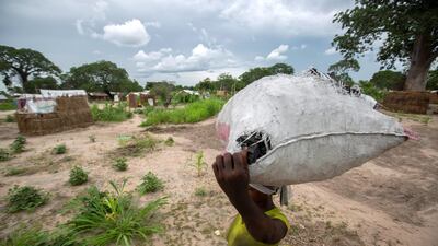 A woman carries a bag of charcoal in the Tara Tara district of Matuge, northern Mozambique. AFP