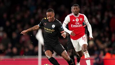 Manchester City's Raheem Sterling, left, with Arsenal's Ainsley Maitland-Niles. PA