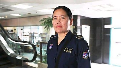 Glenda Ceniza Antolihao, one of 120 female guards at Spark Security Services, works at Yas Marina Circuit. Fatima Al Marzooqi / The National