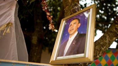 A portrait of Barack Obama hangs from a tree at a festival held in Kogelo, Kenya in the village where his grandmother, Sarah Obama lived. Photo: Rich-Joseph Facun / The National